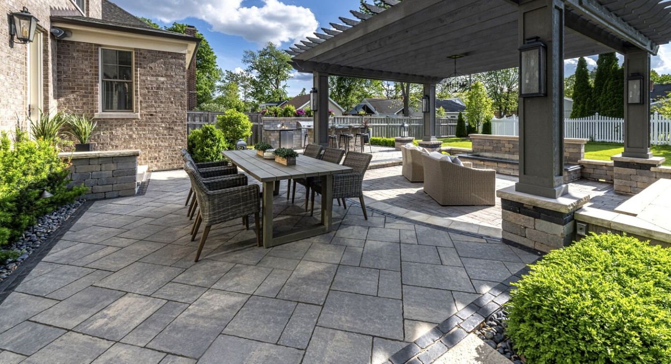 Outdoor patio with pergola showing budget-friendly professional landscaping